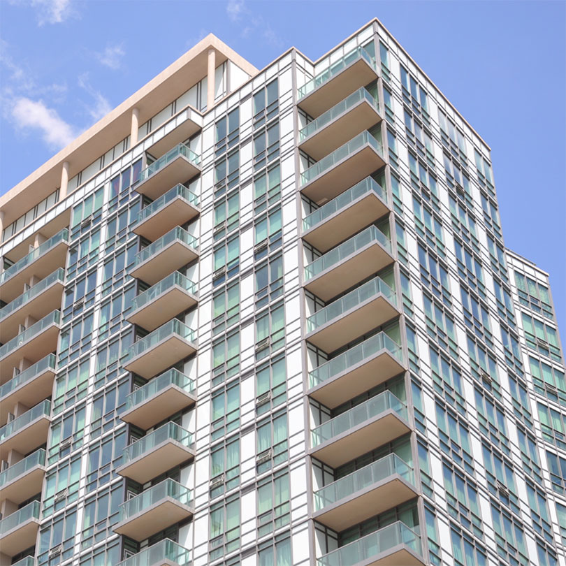 A high-rise apartment with balconies.